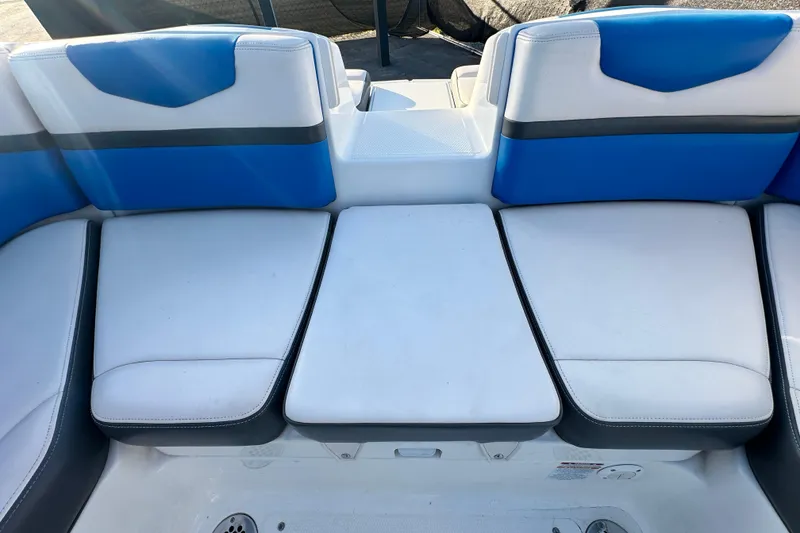 Slide: The Image of 2019 Chaparral Vortex 2430 VRX boat interior with blue and white seating. - 43
