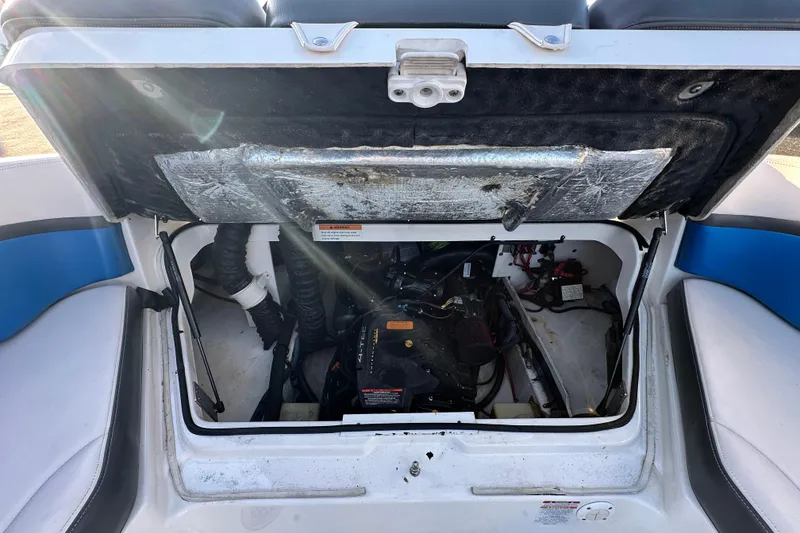 Slide: The Image of Open engine compartment of 2019 Chaparral Vortex 2430 VRX boat, showing internal components. - 44