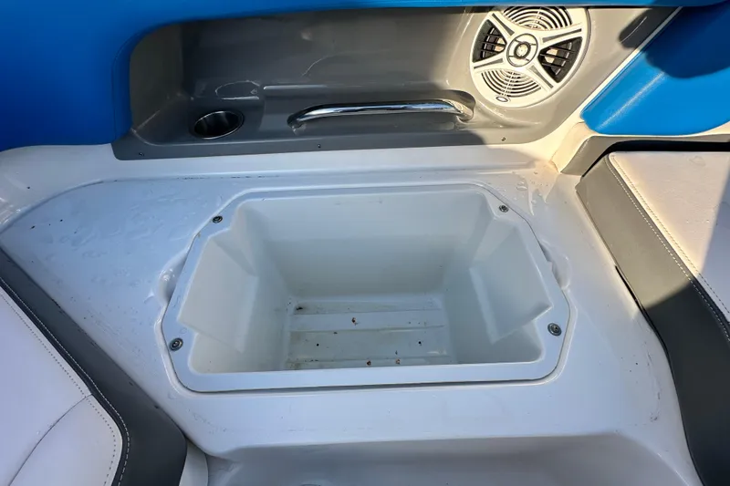 Slide: The Image of 2019 Chaparral Vortex 2430 VRX boat interior with storage compartment and speaker. - 48