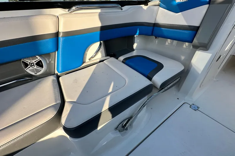 Slide: The Image of 2019 Chaparral Vortex 2430 VRX boat interior with blue and gray seating. - 51