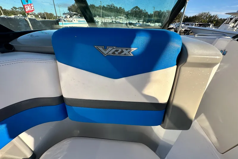 Slide: The Image of 2019 Chaparral Vortex 2430 VRX boat seat with blue and white upholstery. - 55