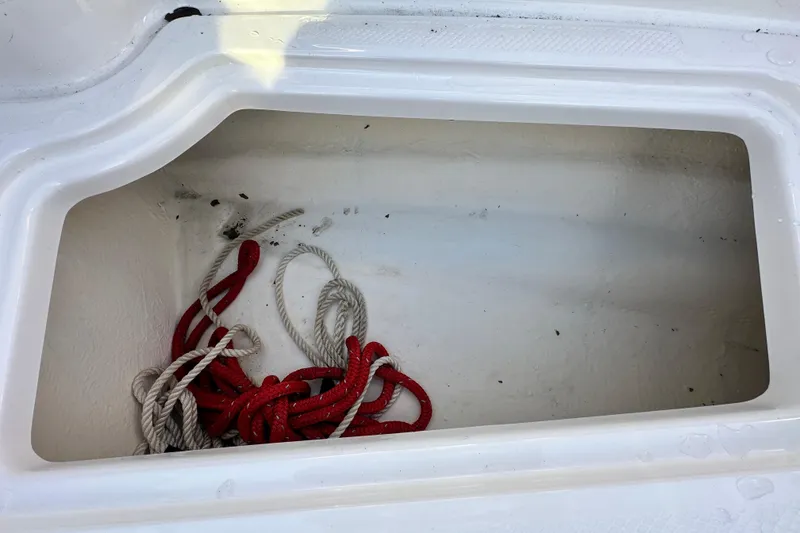 Slide: The Image of Storage compartment with ropes in a 2019 Chaparral Vortex 2430 VRX boat. - 71