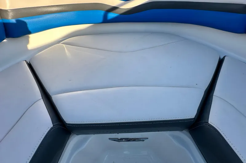 Slide: The Image of 2019 Chaparral Vortex 2430 VRX boat interior with white and blue seating. - 72