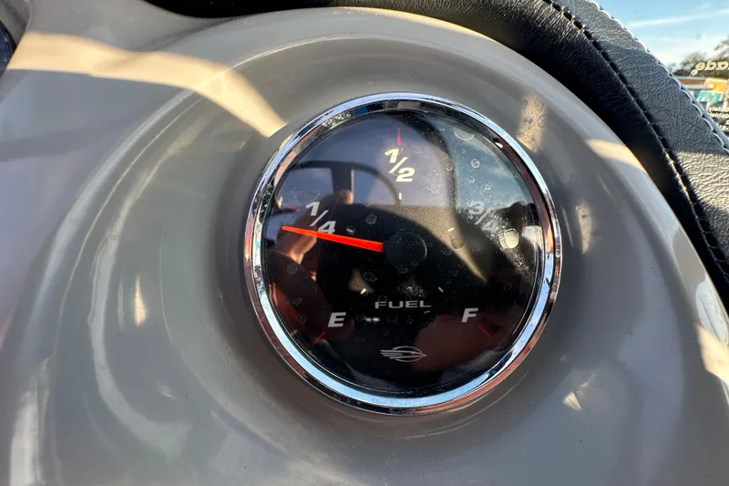 Slide: The Image of Fuel gauge of 2019 Chaparral Vortex 2430 VRX showing quarter tank. - 83