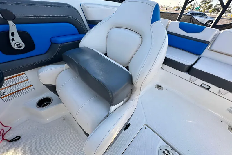 Slide: The Image of 2019 Chaparral Vortex 2430 VRX boat interior with white and blue seating. - 87