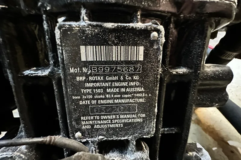 Slide: The Image of Engine information plate on a 2019 Chaparral Vortex 2430 VRX, displaying specifications and serial number. - 93