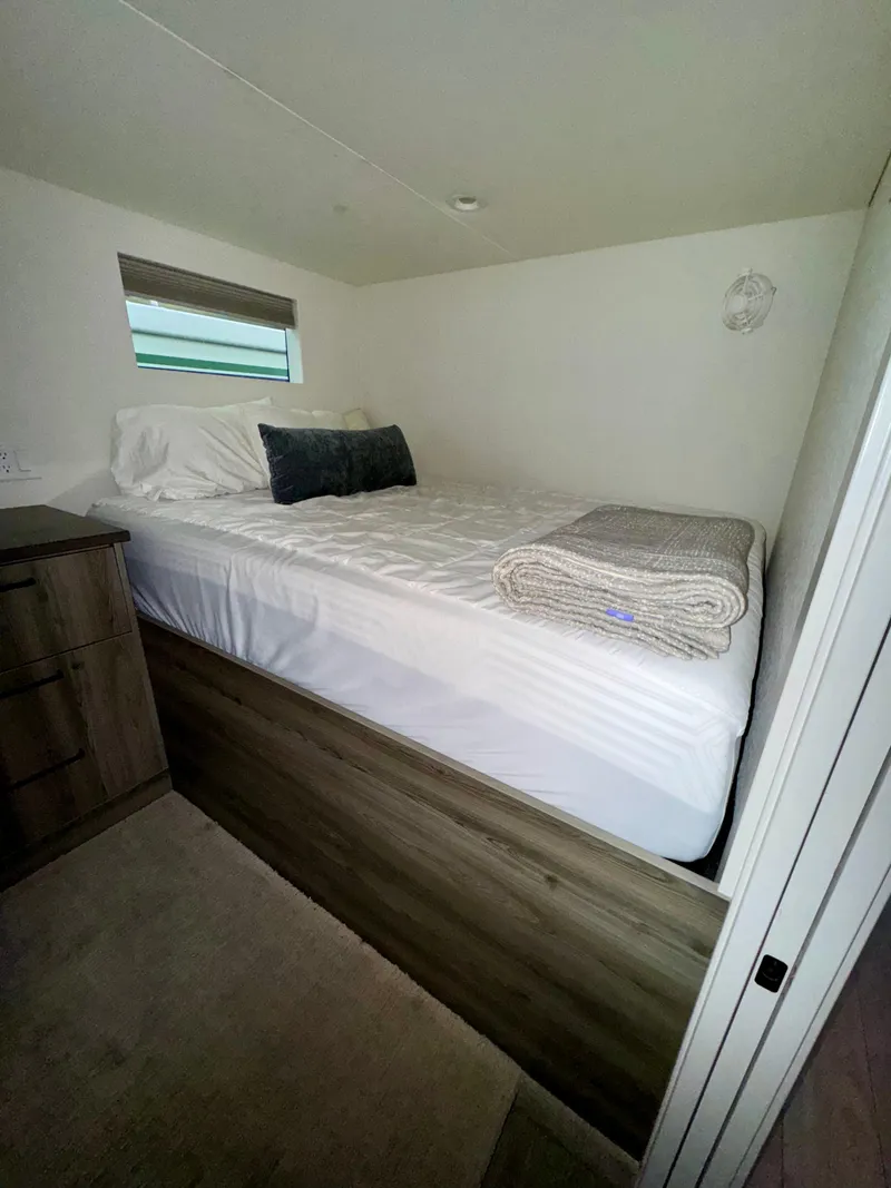 Slide: The Image of Compact bedroom in Adonia Obsession Share Trip #9, 2021 model, featuring a neatly made bed. - 12