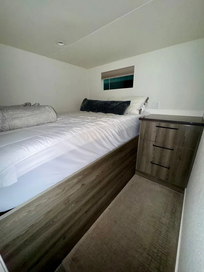 Slide: The Image of Compact bedroom in Adonia Obsession Share Trip #9, 2021 model, featuring a cozy bed and storage. - 13