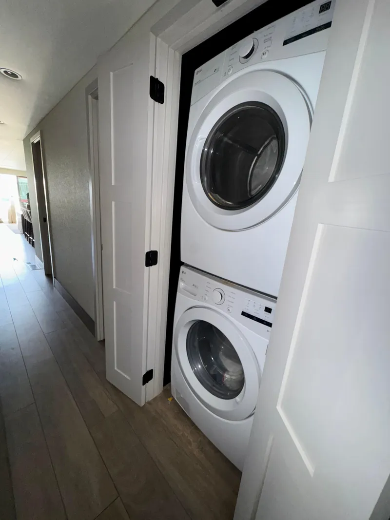 Slide: The Image of Stacked washer and dryer in a modern laundry closet, Adonia Obsession Share Trip #9, 2021. - 14