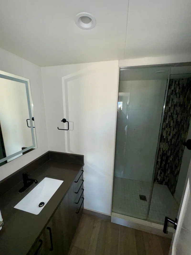 Slide: The Image of Modern bathroom in Adonia Obsession Share Trip #9, 2021 model, featuring sleek vanity and glass shower. - 20