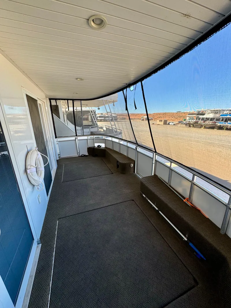 Slide: The Image of Spacious deck of Adonia Obsession Share Trip #9 houseboat, 2021 model, with seating and scenic views. - 21