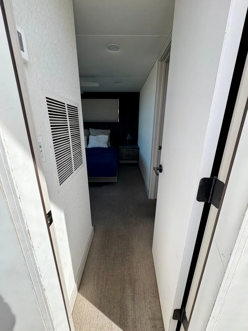 Slide: The Image of Hallway leading to a cozy bedroom in Adonia Obsession Share Trip #9, 2021 model. - 26