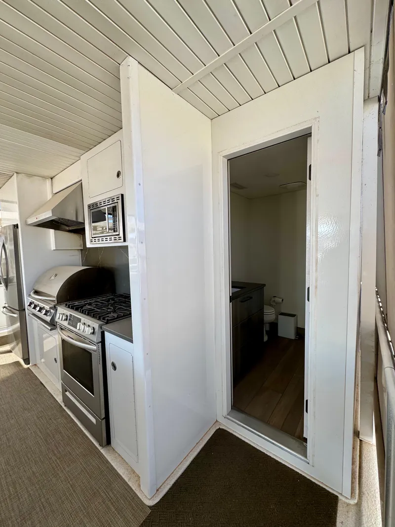 Slide: The Image of Modern kitchen area in 2021 Adonia Obsession Share Trip #9, featuring stainless steel appliances. - 29