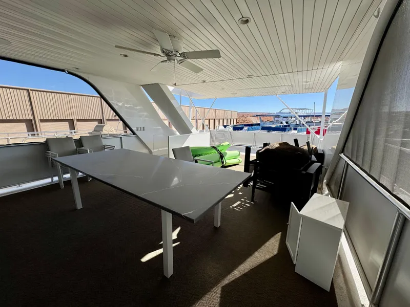 Slide: The Image of Spacious deck area on Adonia Obsession Share Trip #9, 2021 model, featuring seating and table. - 30