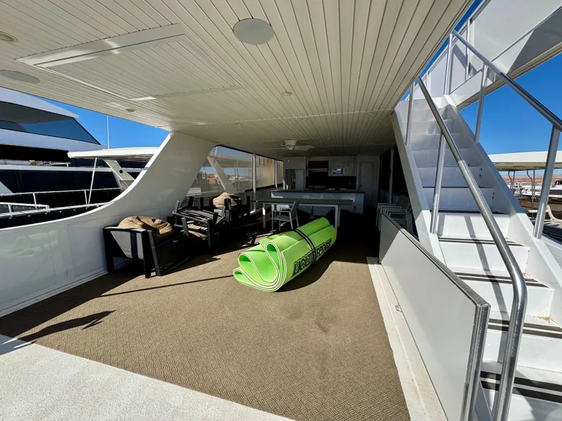 Slide: The Image of Spacious deck of 2021 Adonia Obsession Share Trip #9 yacht with seating and green mat. - 31