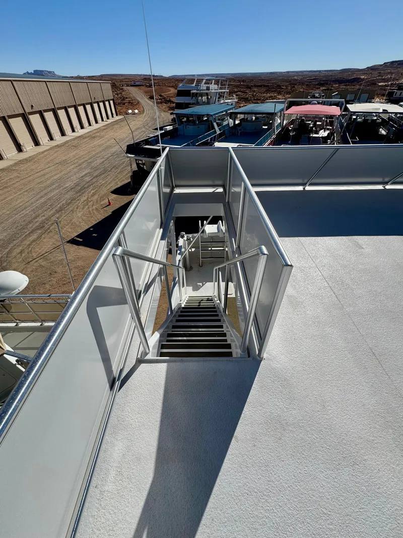 Slide: The Image of Staircase on Adonia Obsession Share Trip #9 boat, 2021, docked with clear sky. - 34