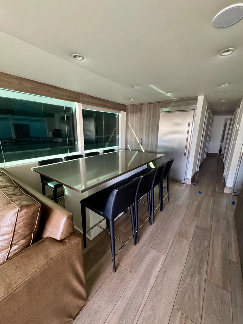 Slide: The Image of Modern interior of Adonia Obsession Share Trip #9, 2021, featuring sleek dining area and seating. - 7