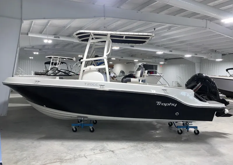 Slide: The Image of 2024 Bayliner Trophy 20CC boat in showroom, side view. - 0