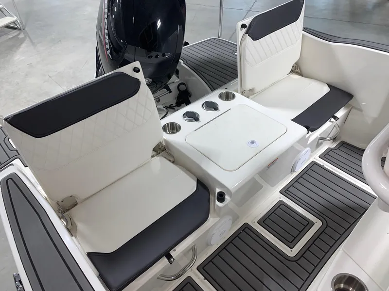 Slide: The Image of 2024 Bayliner Trophy 20CC boat interior with seating and storage. - 5