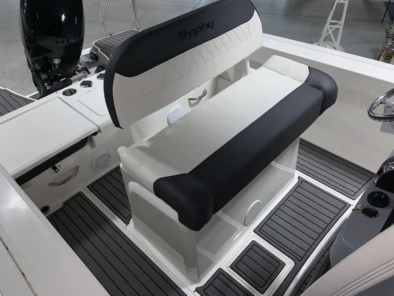 Slide: The Image of 2024 Bayliner Trophy 20CC boat interior with cushioned seating and modern design. - 7
