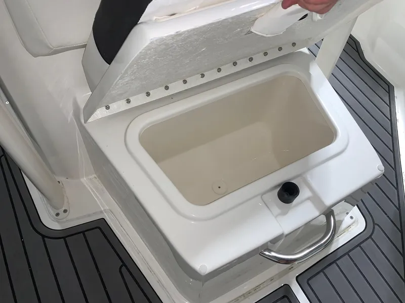Slide: The Image of 2024 Bayliner Trophy 20CC boat storage compartment with open lid. - 11