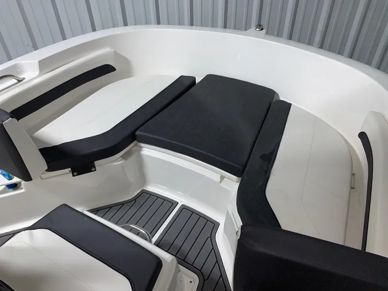 Slide: The Image of 2024 Bayliner Trophy 20CC boat interior with cushioned seating and non-slip flooring. - 12
