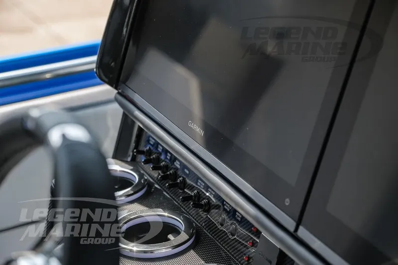 Slide: The Image of 2025 Nor-Tech 450 Sport dashboard with Garmin display and controls. - 16