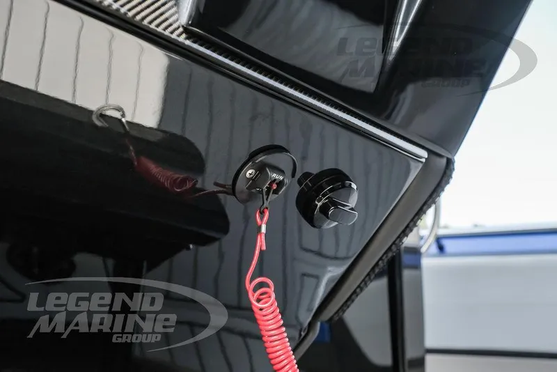 Slide: The Image of Close-up of 2025 Nor-Tech 450 Sport boat dashboard with safety lanyard. - 20