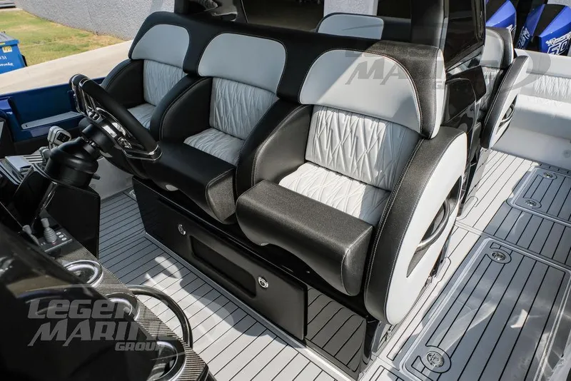 Slide: The Image of 2025 Nor-Tech 450 Sport boat interior with luxurious seating and modern design. - 22