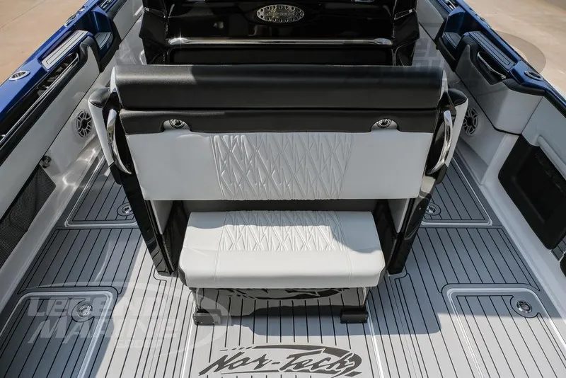 Slide: The Image of 2025 Nor-Tech 450 Sport boat interior with sleek seating and modern design. - 26
