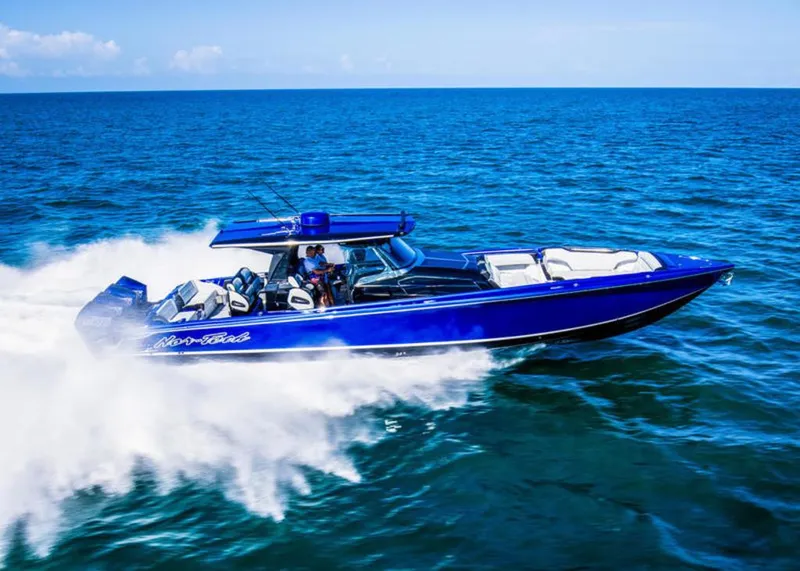 Slide: The Image of 2025 Nor-Tech 450 Sport speedboat cruising on open ocean waters. - 3