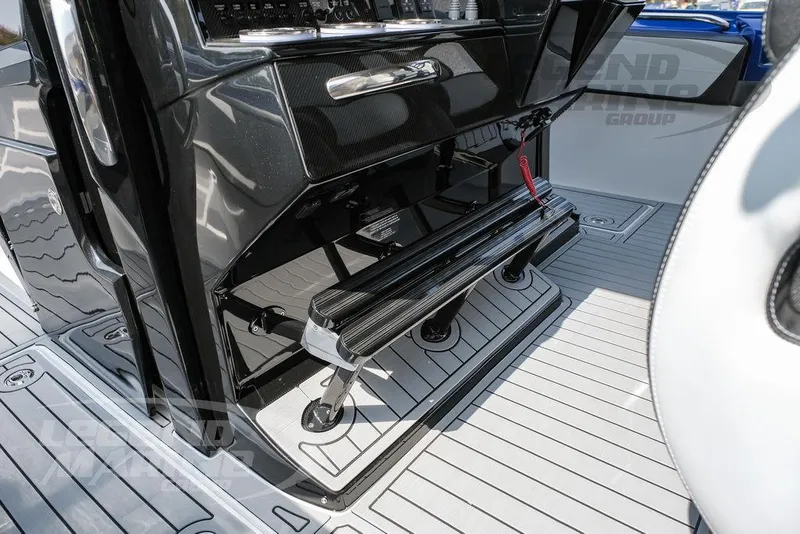 Slide: The Image of 2025 Nor-Tech 450 Sport boat interior with sleek black console and modern design. - 30