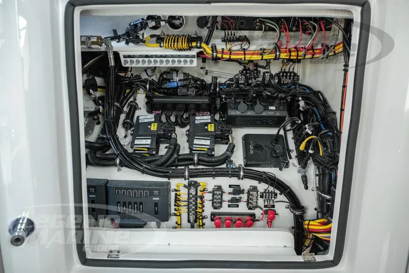 Slide: The Image of Electrical panel of 2025 Nor-Tech 450 Sport boat, showcasing intricate wiring and components. - 41
