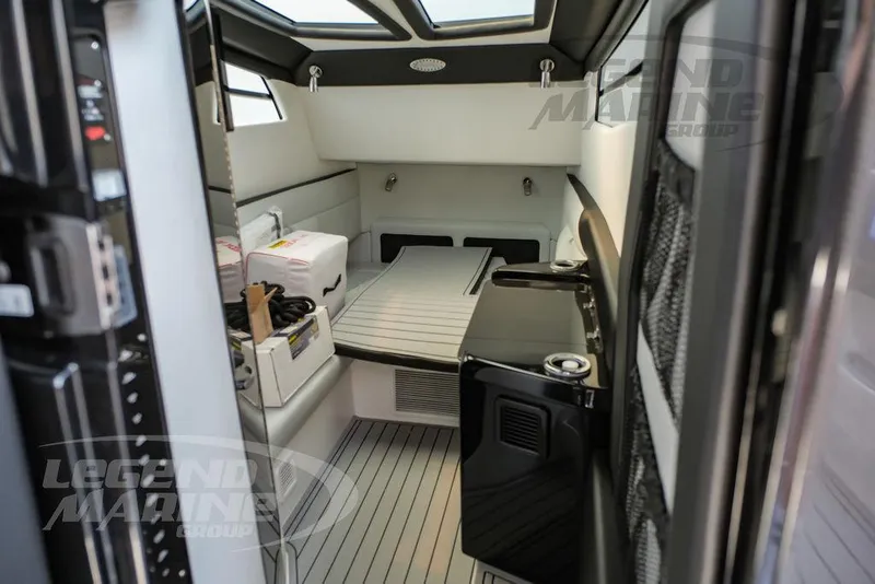 Slide: The Image of Interior cabin of 2025 Nor-Tech 450 Sport boat, featuring modern amenities and sleek design. - 47