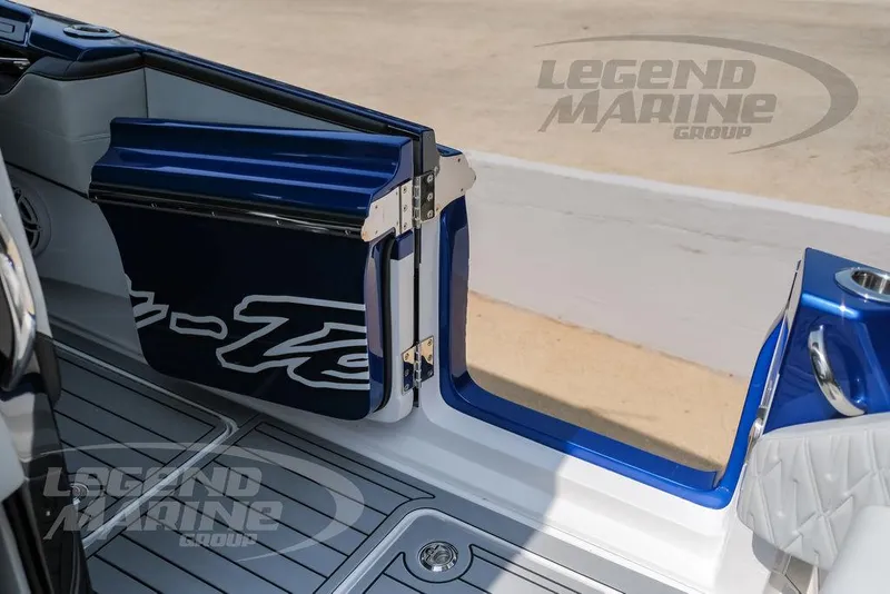 Slide: The Image of 2025 Nor-Tech 450 Sport boat with open side door, featuring sleek blue and white design. - 48