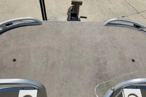 Slide: The Image of 2008 Sun Tracker Party Barge 24 deck with carpet and railing. - 9