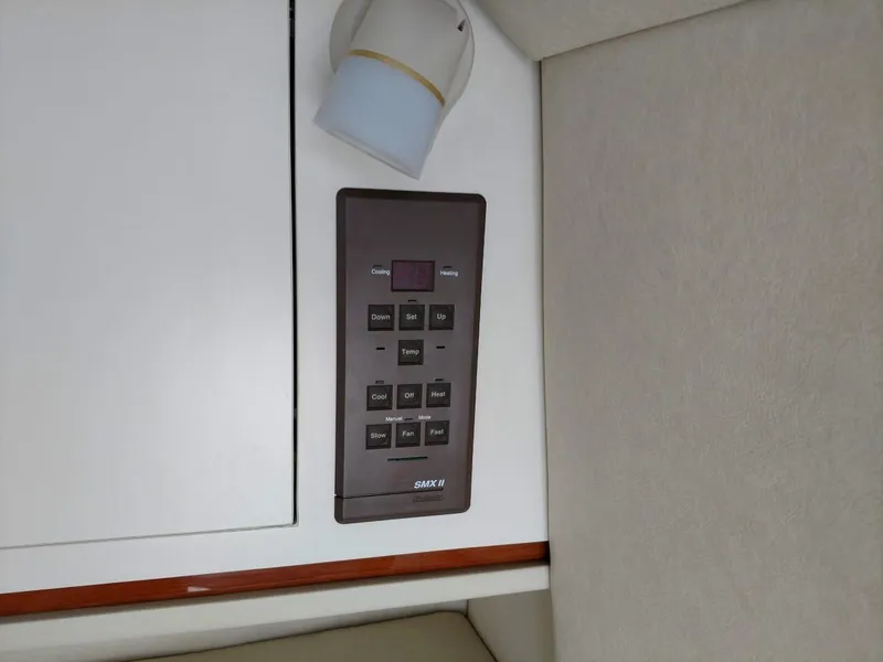 Slide: The Image of Control panel on 2001 Sea Ray 290 Amberjack boat interior. - 13