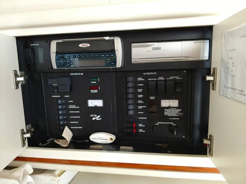 Slide: The Image of Electrical panel of a 2001 Sea Ray 290 Amberjack boat, featuring various controls and switches. - 14