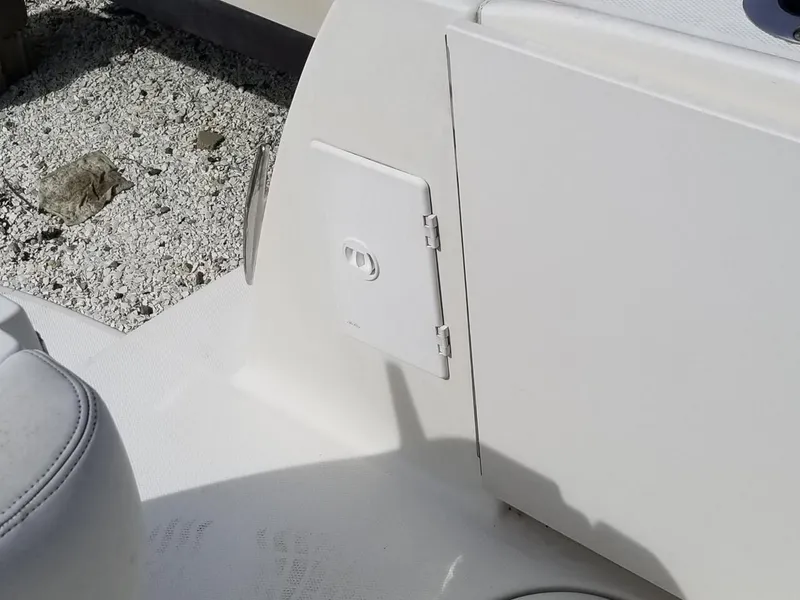 Slide: The Image of 2001 Sea Ray 290 Amberjack boat interior detail with storage compartment. - 31