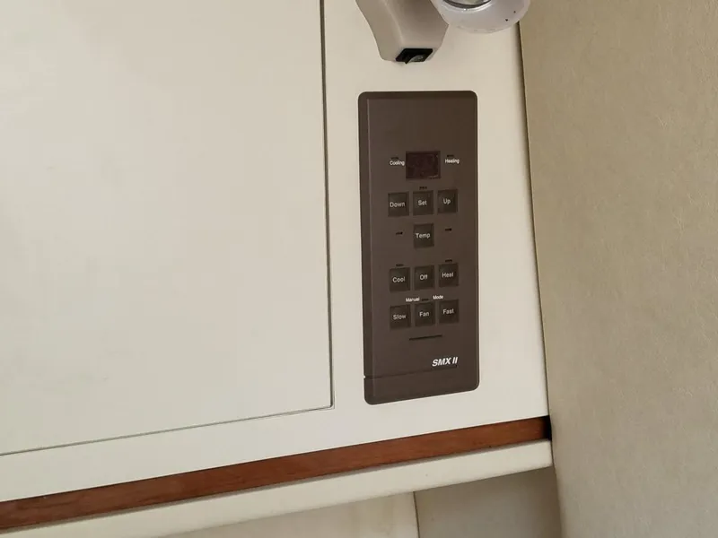 Slide: The Image of Control panel on 2001 Sea Ray 290 Amberjack boat interior. - 36