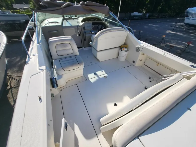 Slide: The Image of 2001 Sea Ray 290 Amberjack boat interior with seating and steering wheel. - 4