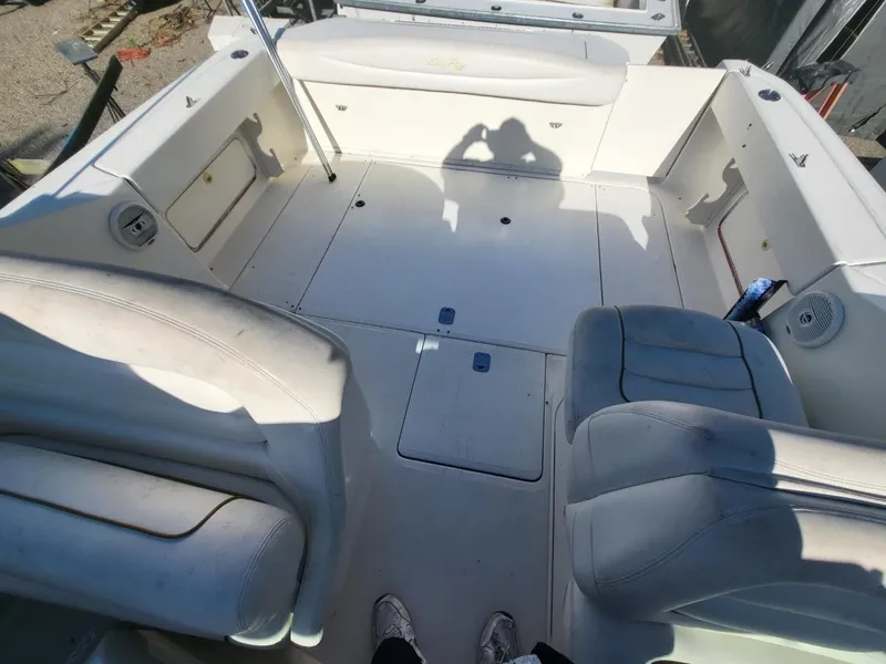 Slide: The Image of 2001 Sea Ray 290 Amberjack boat interior with seating and storage compartments. - 43