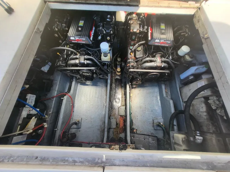Slide: The Image of Engine compartment of a 2001 Sea Ray 290 Amberjack with dual engines visible. - 46