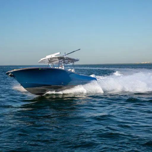 The Image of 2019 Mag Bay Center Console boat cruising on open water. - 0