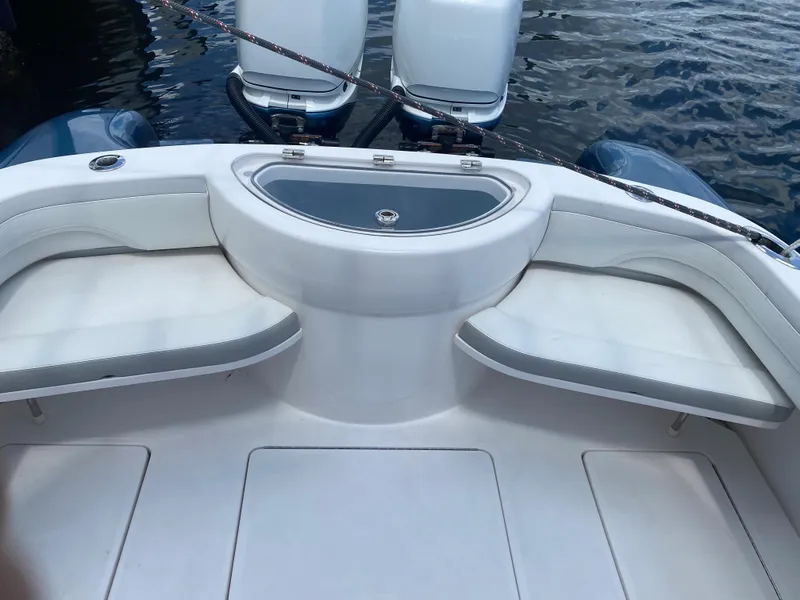 Slide: The Image of 2019 Mag Bay Center Console boat interior with seating and dual engines. - 5