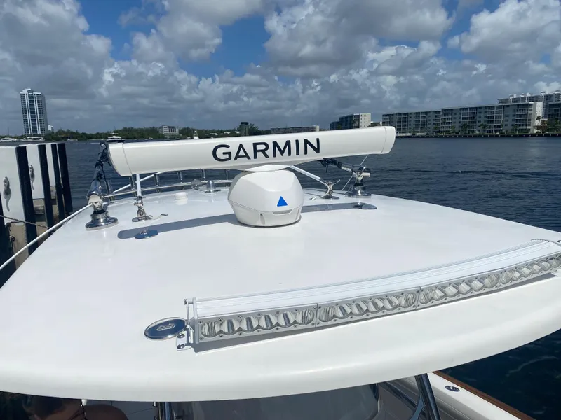 Slide: The Image of 2019 Mag Bay Center Console boat with Garmin radar on calm water. - 8