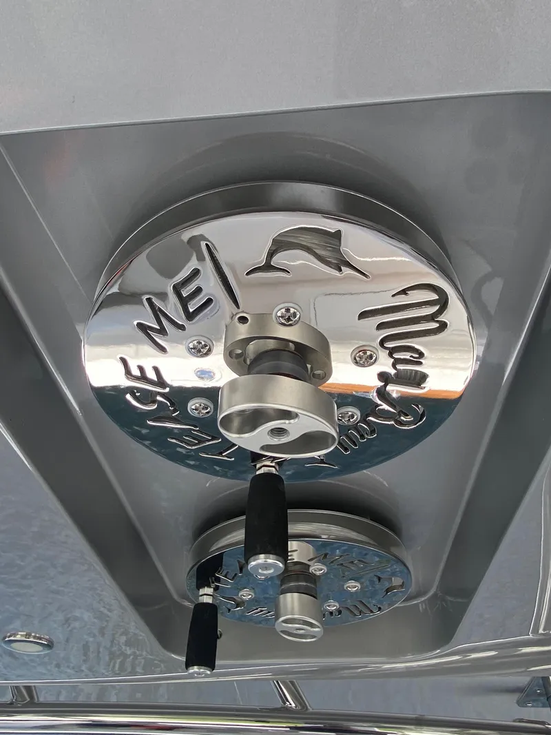 Slide: The Image of 2019 Mag Bay Center Console boat detail with custom metalwork and dolphin engraving. - 9