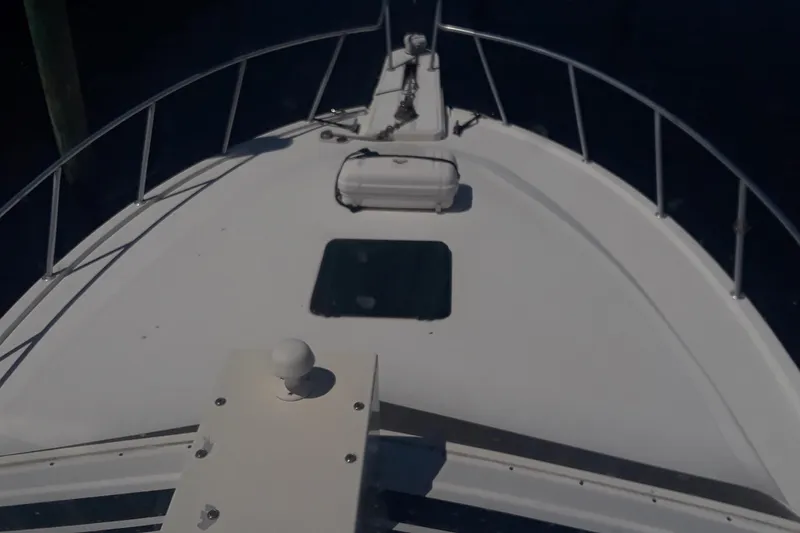 Slide: The Image of Bow view of 1987 Blackfin 36 Convertible boat with railing and hatch. - 10