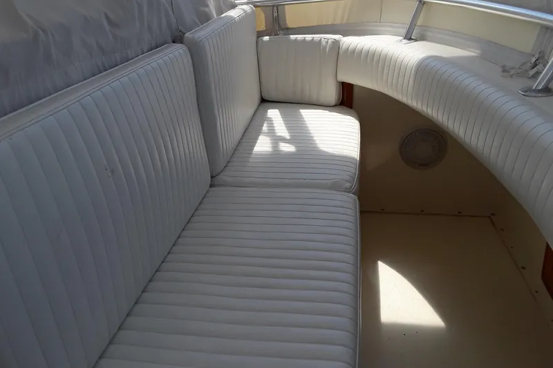 Slide: The Image of 1987 Blackfin 36 Convertible boat with white cushioned seating. - 16