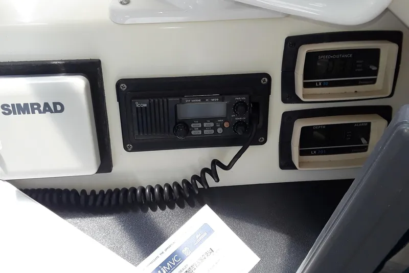 Slide: The Image of 1987 Blackfin 36 Convertible boat dashboard with Simrad and Icom marine electronics. - 20
